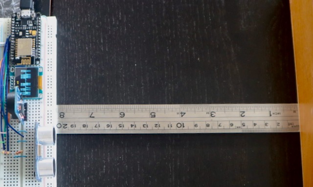 The device used for this experiment. A NodeMCU development board controls the HC-SR04 sensor to the computer using a USB interface.